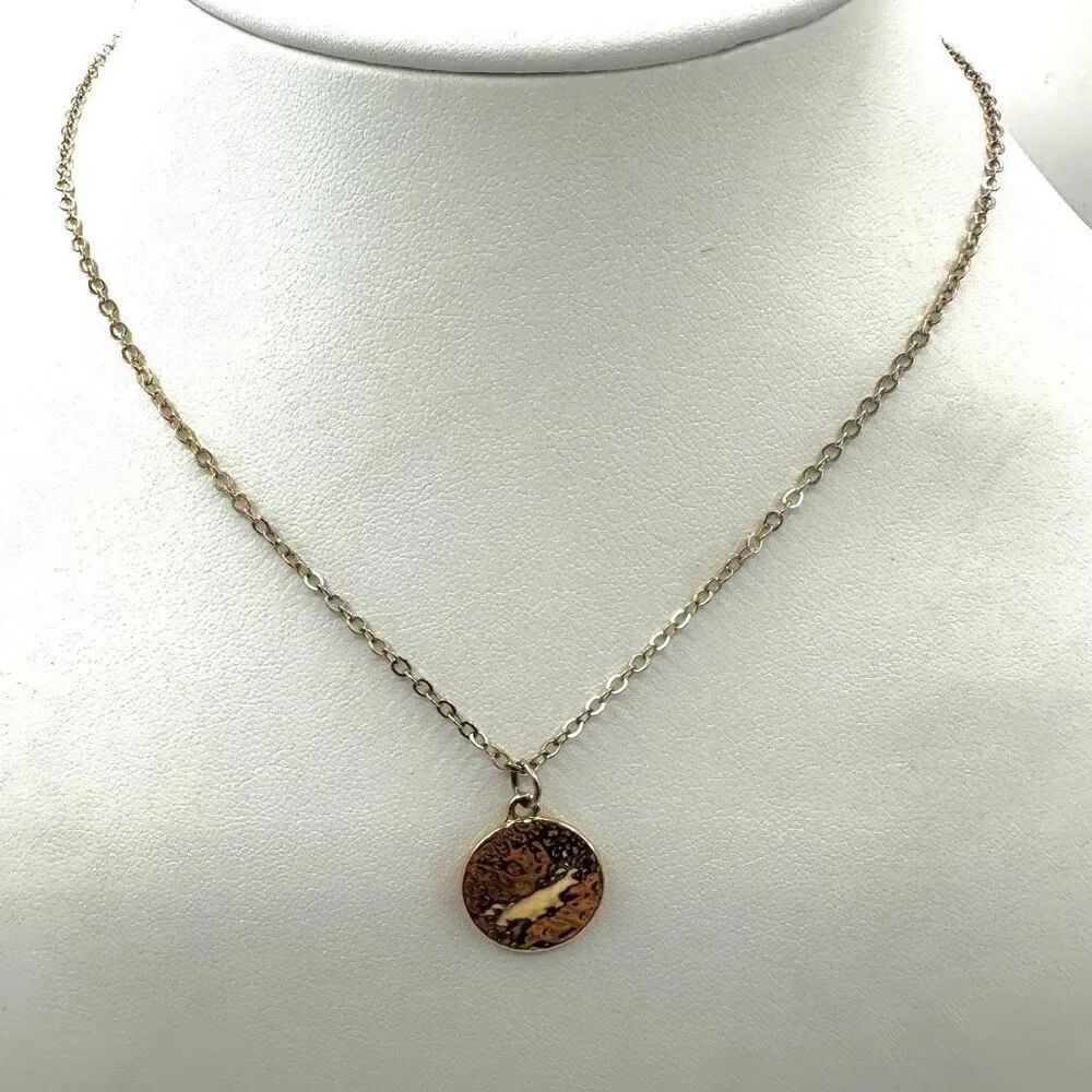 Gold tone circle pendant necklace